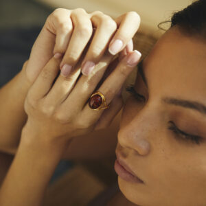 Elegant gold-plated ring with cognac amber