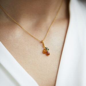 Gold plated necklace with green, yellow and cognac amber