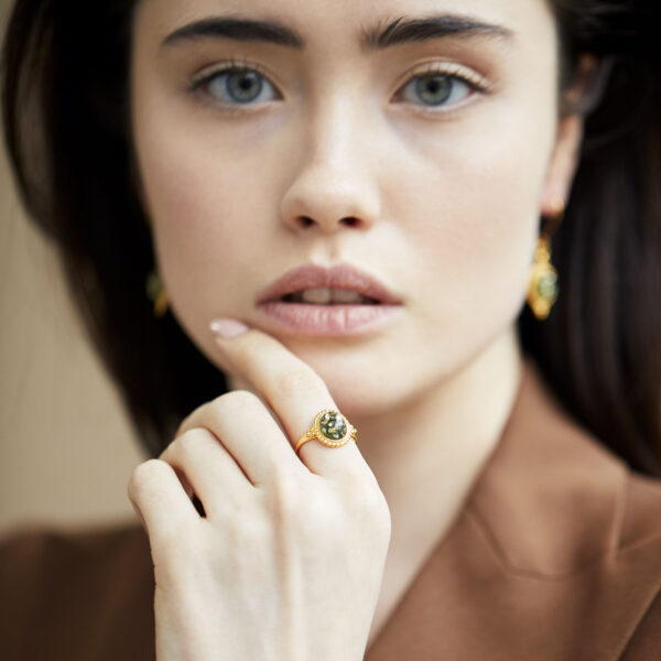 Gold plated ring with green baltic amber